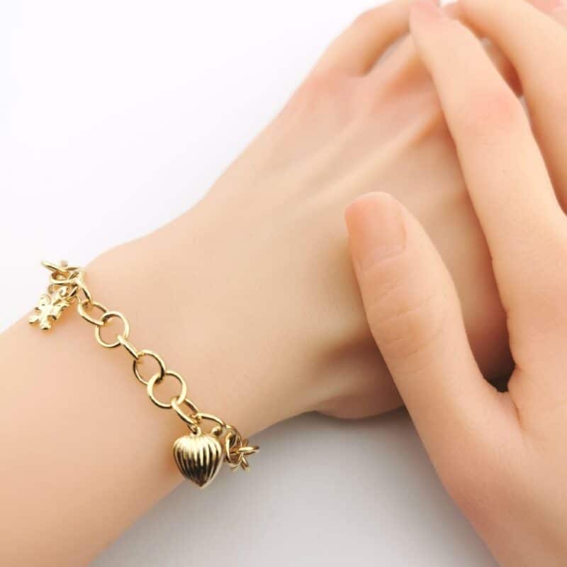 Bransoletka z żółtego złota z ogniw z zawieszkami serce, motyl i łezka 76335