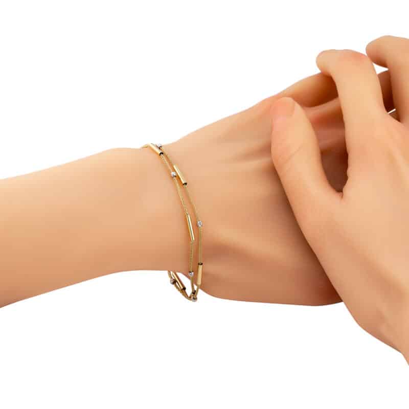 Bransoletka z żółtego i białego złota z patyczkami i diamentowanymi kuleczkami 83214