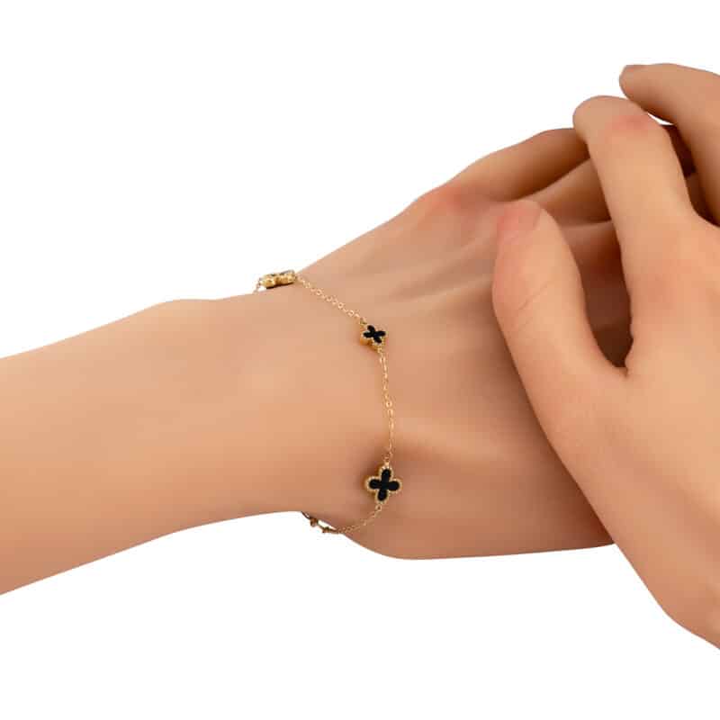 Bransoletka z żółtego złota z marokańskimi koniczynkami i czarną emalią 84081