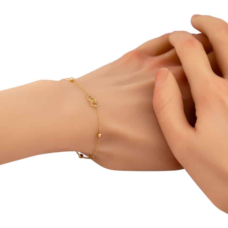 Bransoletka z żółtego złota z serduszkami i kuleczkami z kolekcji DALL’ACQUA 84192