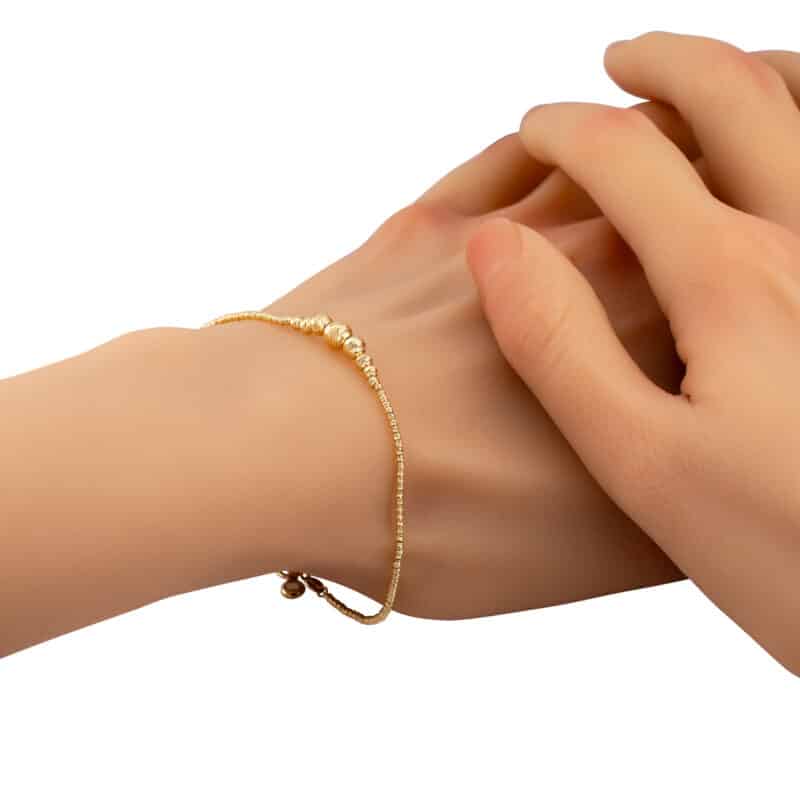 Bransoletka z żółtego złota z grawerowanymi kulkami 85117