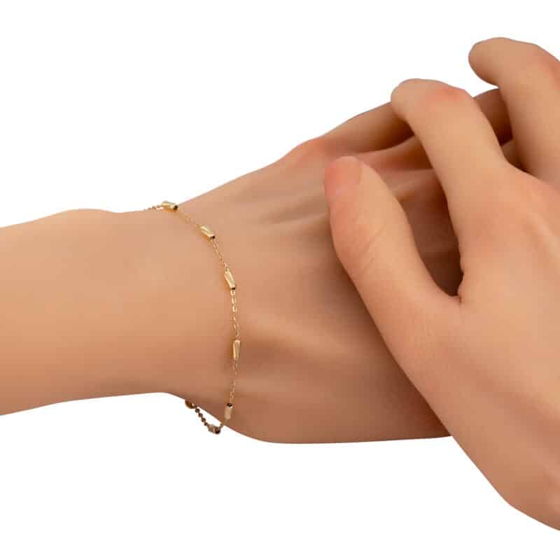 Złota bransoletka z diamentowanymi podłużnymi elementami 85214